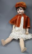 A bisque headed doll by "Max Handwerk" Germany length 70cm