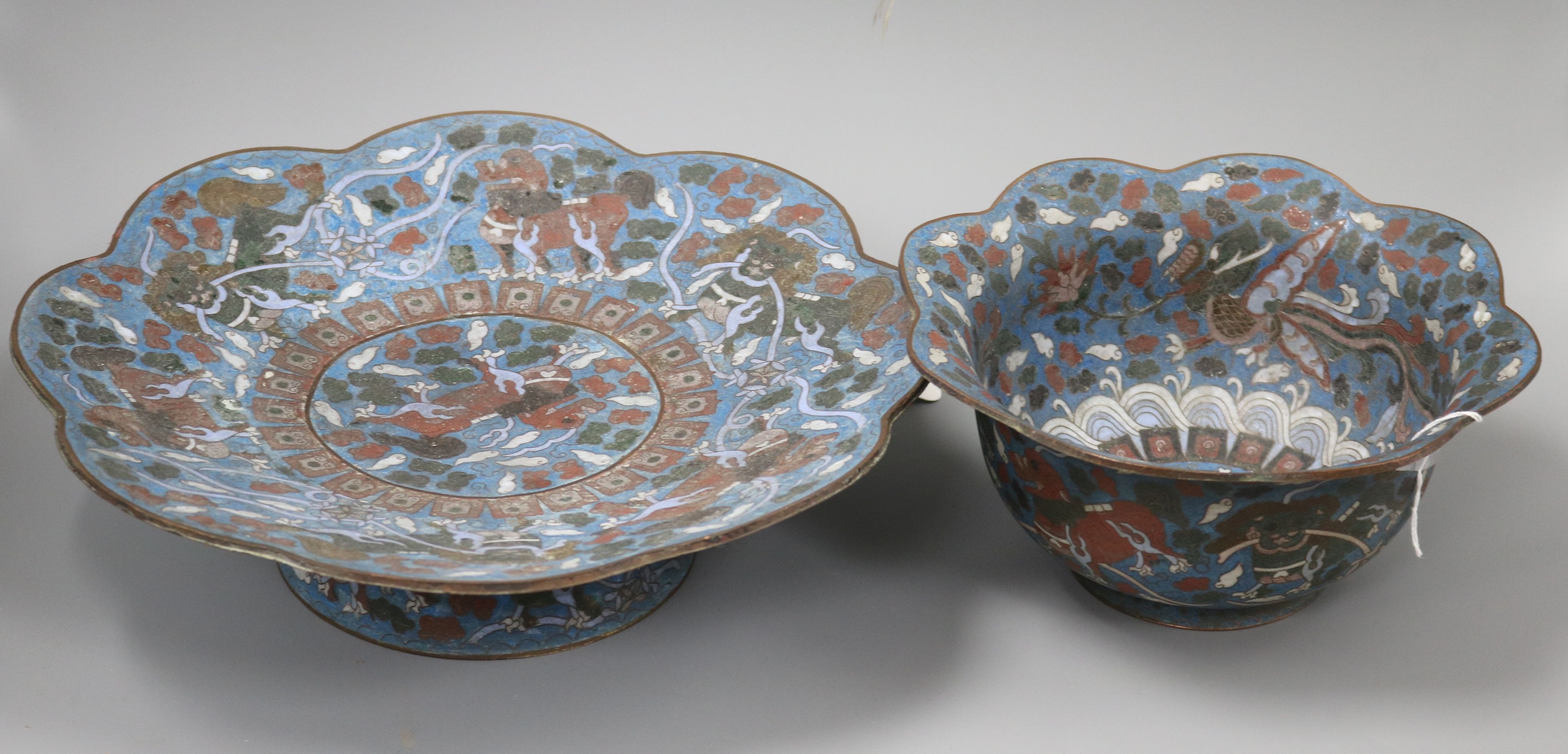 A Chinese blue ground cloisonne bowl with 'petal' rim and a similar footed bowl, the smaller deep