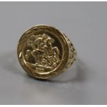 A 9ct gold ring embossed with "half sovereign" decoration, size M.