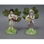 A pair of Walton pearlware figures of fruit sellers tallest 19cm