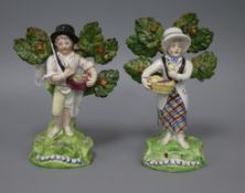 A pair of Walton pearlware figures of fruit sellers tallest 19cm