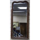 A Queen Anne walnut and parcel-gilt wall mirror W.42cm