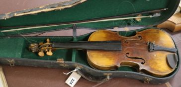 A full sized cased violin with bow