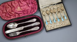 Two cased sets - six white metal and enamel teaspoons and a Victorian three piece silver Christening