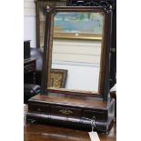 A carved toilet mirror W.39cm