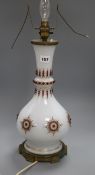 A French 'jewelled' opaline white glass table lamp, heightened in gilt height 45cm