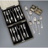 A miniature silver cutlery tray with two small knives and flatware including two cased sets of