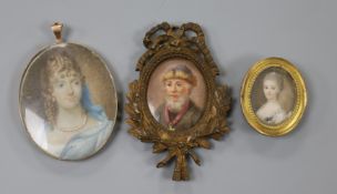 A small 18th century oil on ivory miniature of a lady, 3 x 2.5cm and two other miniatures