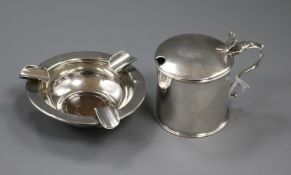 A George III silver mustard, London 1785, maker Robert Hennell and a silver ashtray inset with a