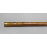 A 22ct gold mounted malacca cane dated 1774 by Lawrence Johnson, the finial bright cut with festoons