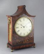 An early 19th century brass inlaid mahogany table clock, William North, York, the pagoda case with