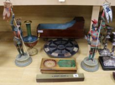 A 19th century doll's cot, a table game, a pair of knight figures, a spirit level, an Oriental style