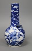 A blue and white vase painted with dragons and birds