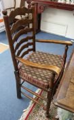 A set of six early 19th century ash and elm rush seated ladderback chairs