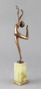 A Lorenzl Art Deco bronze figure of a dancer, signed, raised on a green onyx base, height 13in.