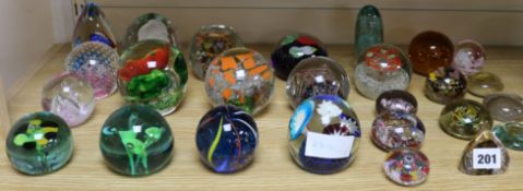 A collection of glass paperweights