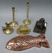 A copper fish shaped jelly mould, a hand desk weight, candlesticks etc tallest 22cm