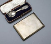 An engine turned silver cigarette case and a cased christening spoon.
