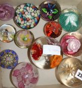 A collection of Caithness and other glass paperweights