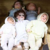 A Simon & Halbig bisque head doll and four other dolls, the S & H doll with sleeping eyes, open