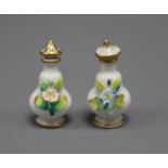 A pair of miniature floral encrusted scent bottles and stoppers height 6cm