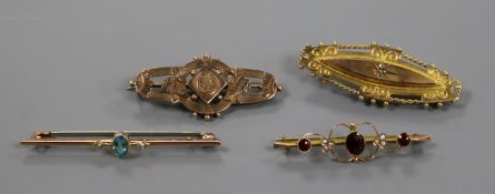 Four assorted 9ct gold brooches including gem set and early 20th century, gross 10.1 grams.