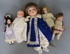 A Heubach Koppelsdorf doll and four other smaller bisque head dolls, the HK doll marked '320.3/0',