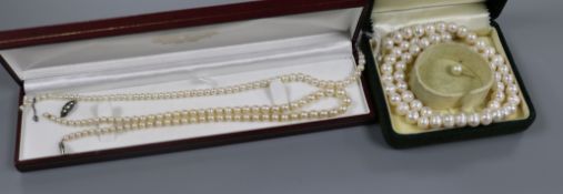 Three assorted cultured pearl necklaces.