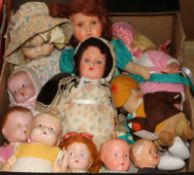 A collection of mid-20th century cloth, celluloid and plastic dolls, including small baby dolls by