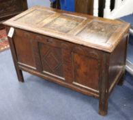 An 18th century carved oak coffer W.87cm