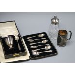 A cased silver christening egg cup and spoon, a set of six silver teaspoons, a silver christening