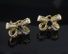 A pair of 18ct yellow gold, sapphire and diamond 'ribbon bow' earrings, with post and clip