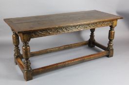 A 19th century James I style oak refectory table, with baluster legs and all round stretchers, W.6ft