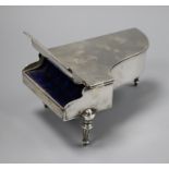 An Edwardian novelty silver trinket box modelled as a grand piano, by William Comyns, London,