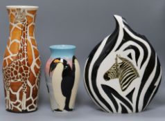 A Denis China Works giraffe vase and a penguin vase together with an Anita Harris studio zebra