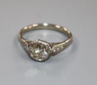 A diamond solitaire ring, the old-cut diamond approx 1.0ct, with diamond-set shoulders on white gold