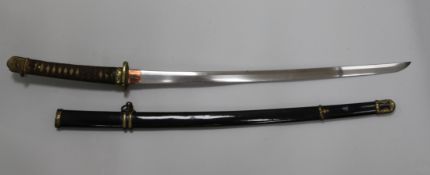 A Showa-To Samurai katana, with gilt brass mounts and bound shagreen grip and black lacquered