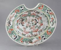 A Chinese export famille verte oval barber's bowl, Kangxi period, painted with birds amid flowers