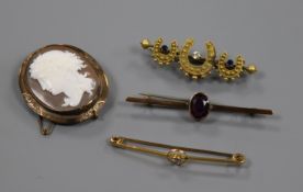 A 15ct gold and gem set bar brooch, two other bar brooches and a yellow metal mounted cameo brooch.