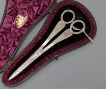 A cased pair of Victorian engraved silver scissors, Wakely & Wheeler, London, 1884, 16.8cm.