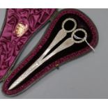 A cased pair of Victorian engraved silver scissors, Wakely & Wheeler, London, 1884, 16.8cm.