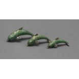 A modern graduated set of three Italian silver and enamel dolphins, largest 53mm.