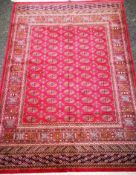 A Bokhara red ground rug 190 x 132cm