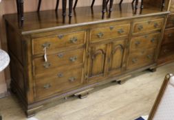 A 18th century style oak dresser base W.197cm