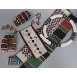 A collection of Zulu beadwork, probably early 20th century, of typical colourful geometric design,