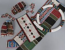A collection of Zulu beadwork, probably early 20th century, of typical colourful geometric design,