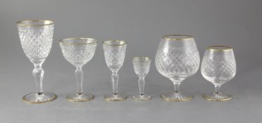 A Stuart thirty four piece part suite of cut glassware, with gilded rims and feet
