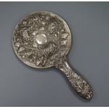 An early 20th century Chinese Export white metal hand mirror, by Hung Chong?, decorated with