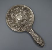 An early 20th century Chinese Export white metal hand mirror, by Hung Chong?, decorated with