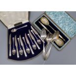 Two cased sets of cutlery including silver and three continental white metal spoons.